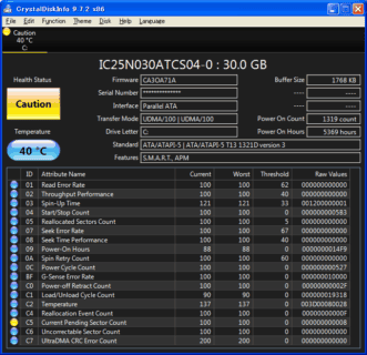 CrystalDiskInfo dark theme reporting drive health and temperature